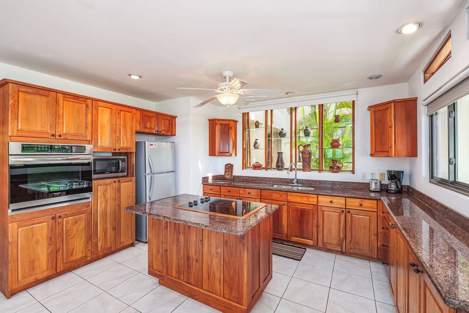 Large oven, multi-function microwave and toaster oven and counter style cooktop.