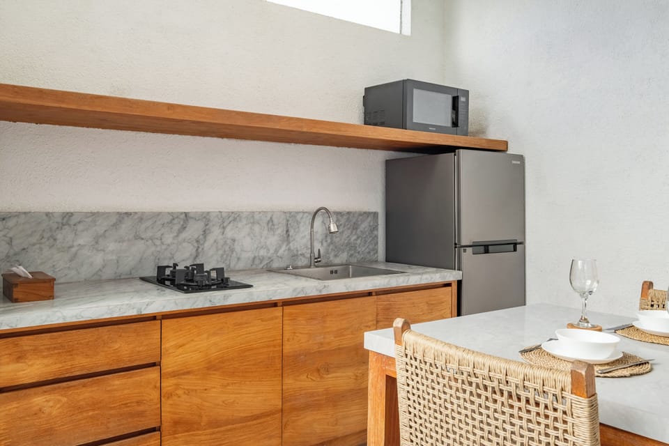 Villa | Private kitchen | Fridge, microwave, stovetop, cookware/dishes/utensils