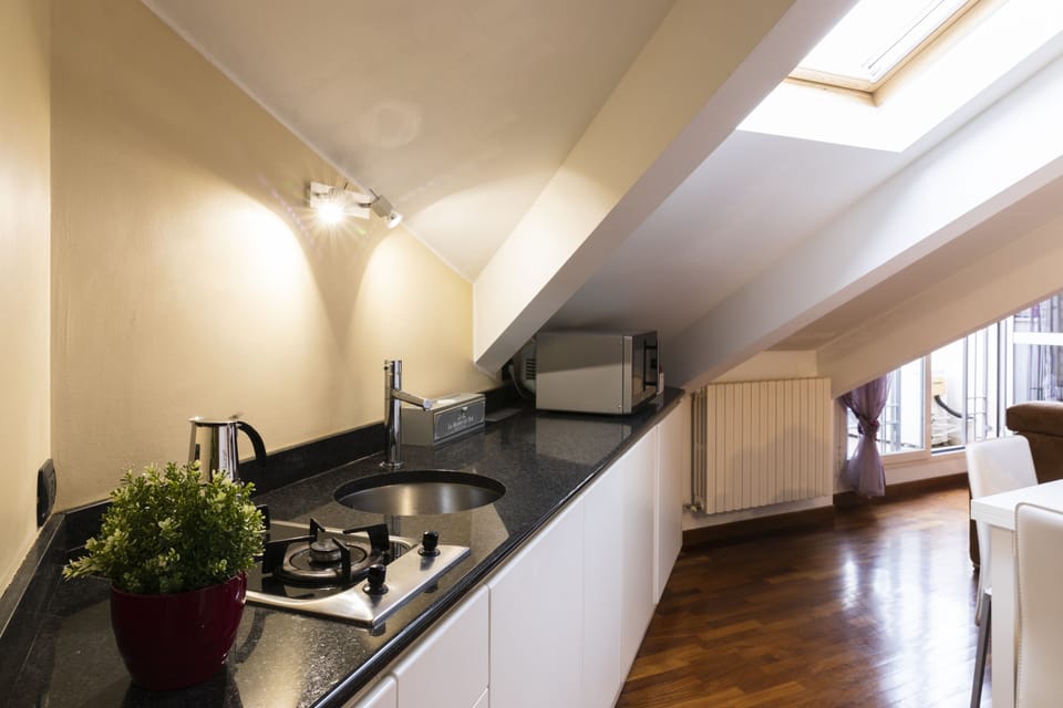Apartment | Private kitchen | Microwave, stovetop, dishwasher, cookware/dishes/utensils