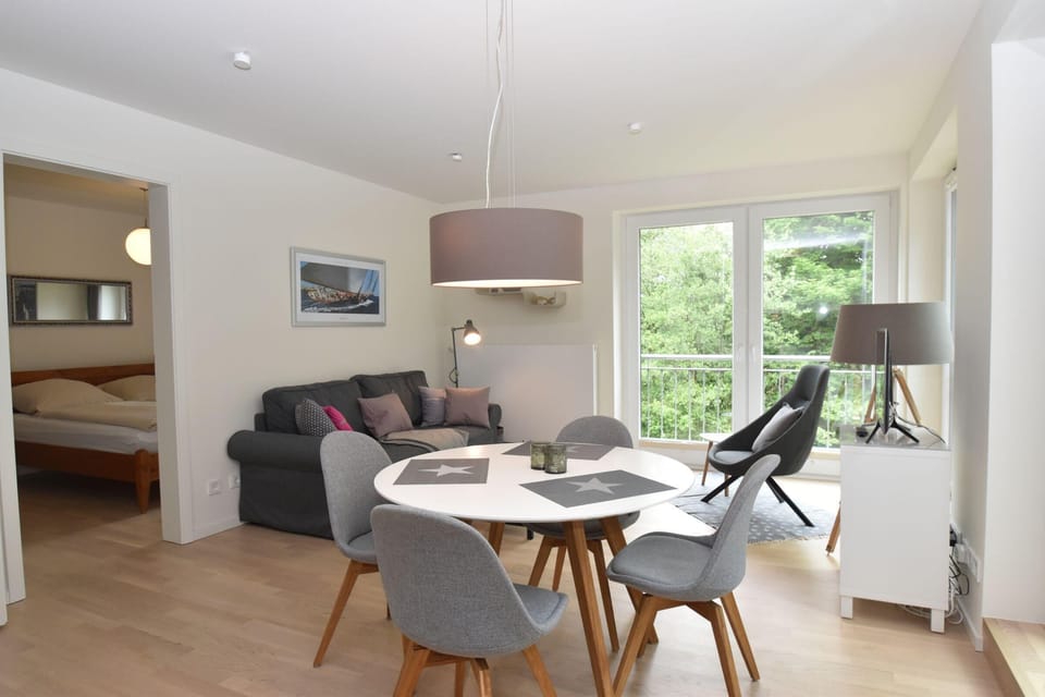 open kitchen with dining area and access to the living room