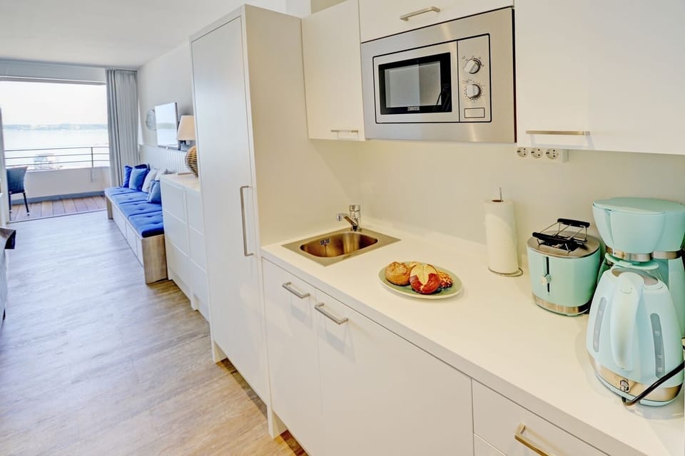 open kitchen with dining area and access to the living room