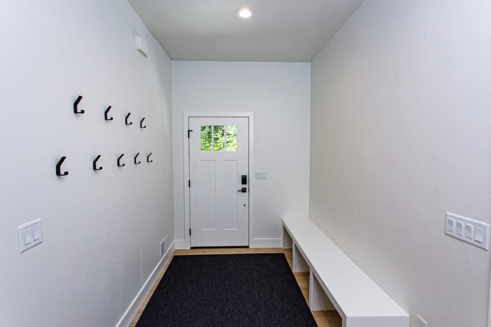 Large entryway with places for all your gear
