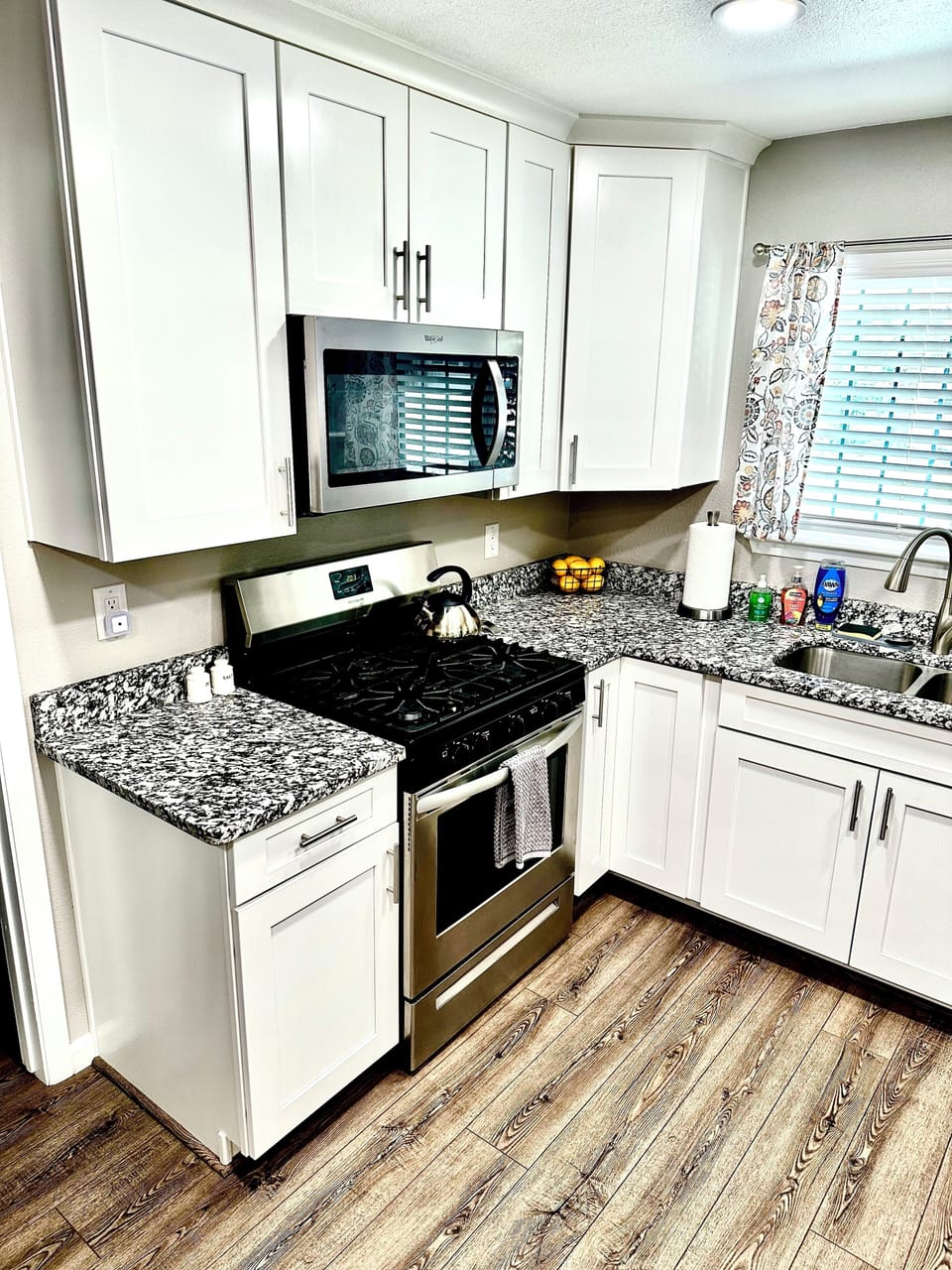 Kitchen with gas stove/oven and microwave