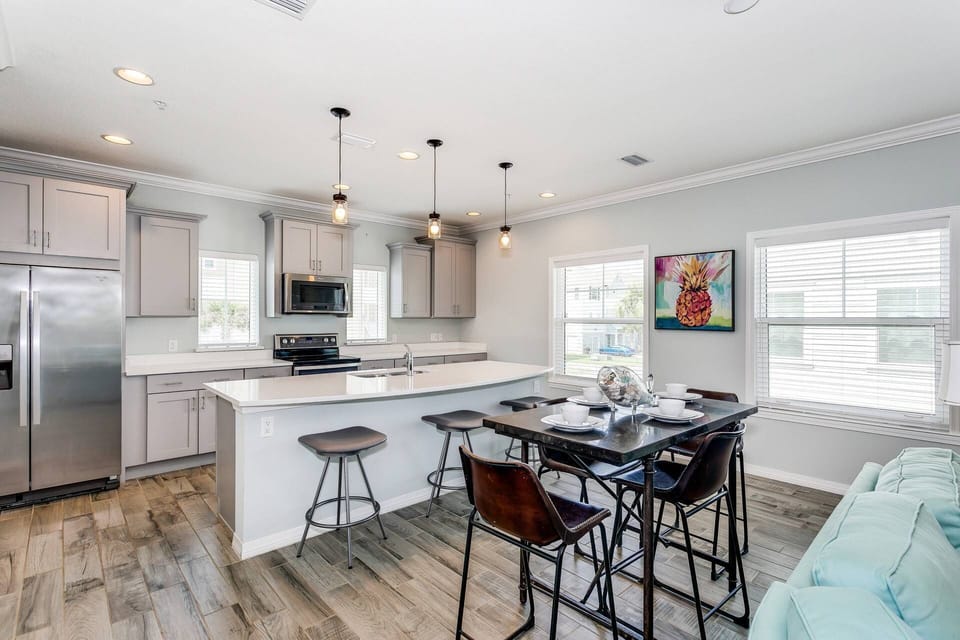 Dining table seats 4 with room for 3 at the kitchen counter