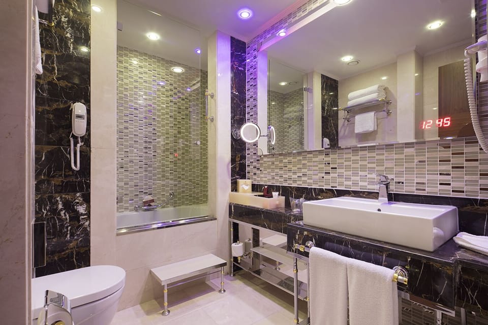 Combined shower/tub, free toiletries, hair dryer, slippers