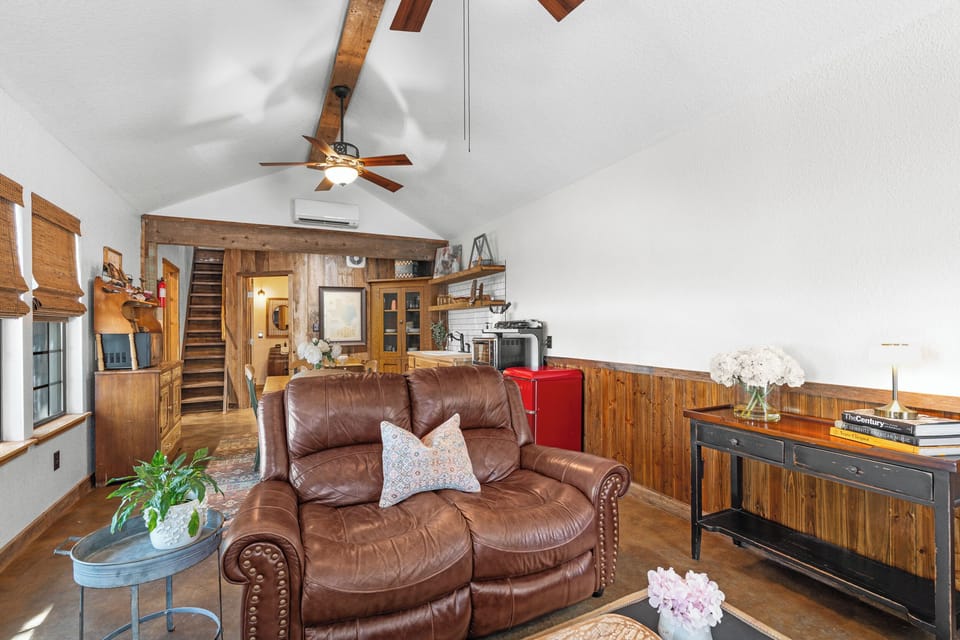 Settle into a cozy corner with rustic décor, comfy seating, and the glow of a welcoming living space.