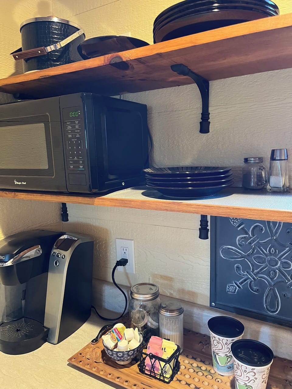 Dishware, flatware, and there's a grill right outside, as well as a bistro set!