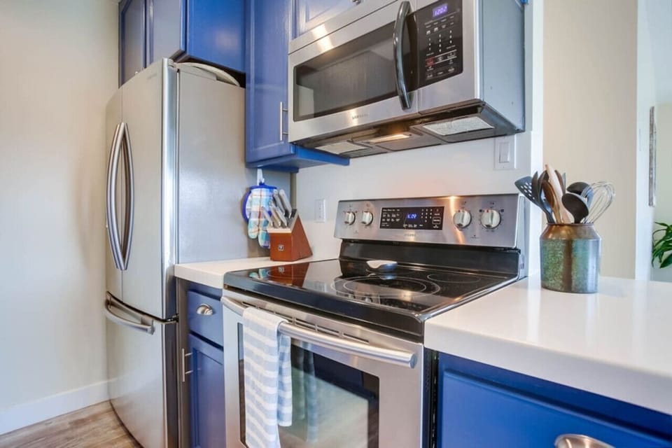 electric range, full size refrigerator and microwave