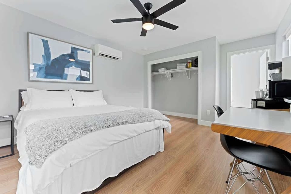 This cozy Austin, Florida retreat features a queen bed, smart TV, workspace & coffee machine, with a large window framing peaceful views capturing the charm of Austin, Florida in Austin, Florida.