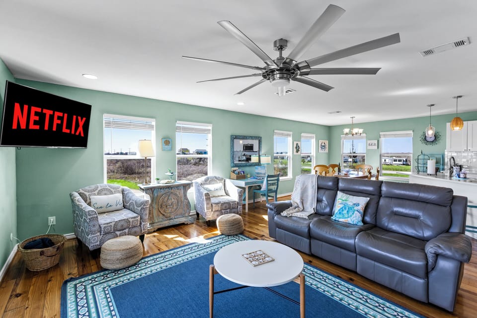 Plenty of seating with two reclining sofas and comfy chairs for movie nights and family time.