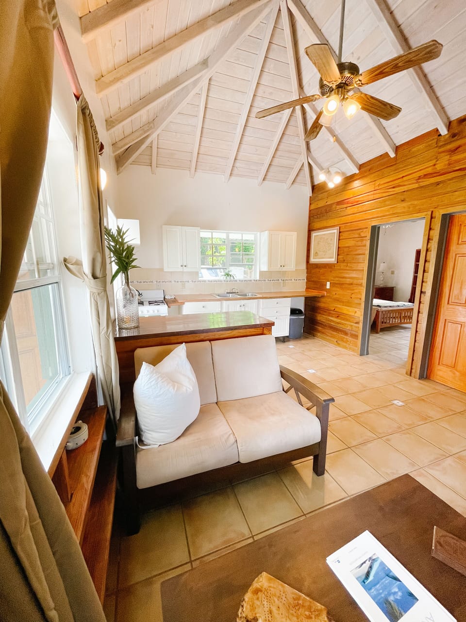 The indoor living space and kitchen.