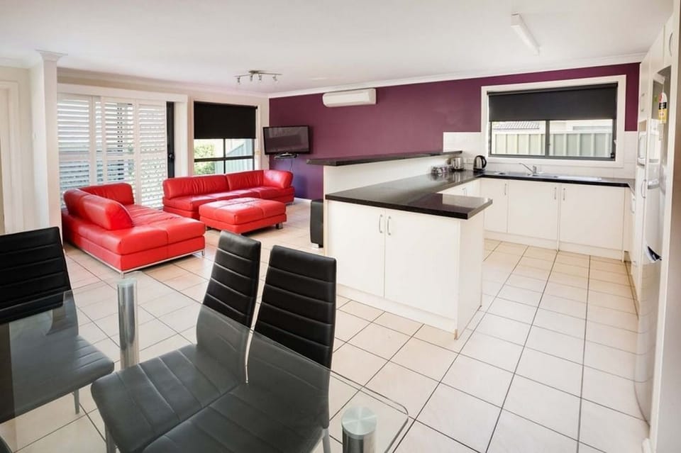 Apartment, 3 Bedrooms | Living area | Flat-screen TV, DVD player