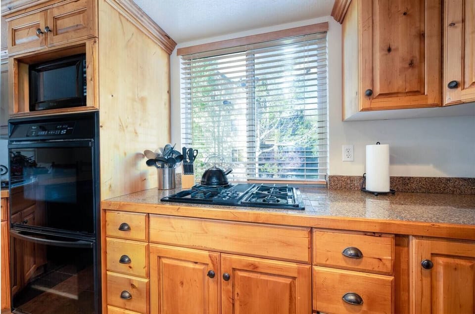 Cook your favorite meals in a kitchen bathed in natural light that enhance the culinary experience.