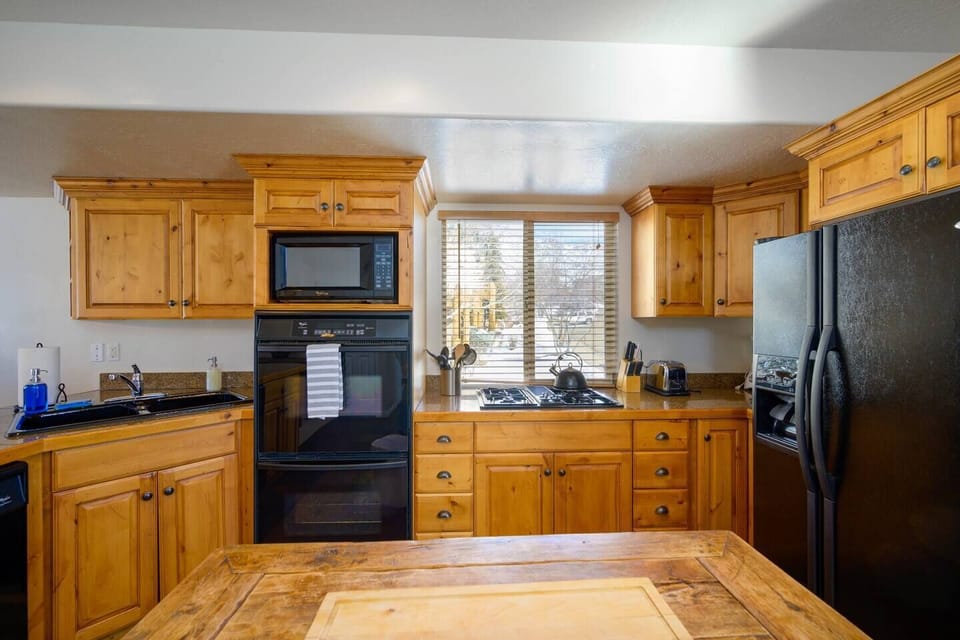 Cook your favorite meals in a kitchen bathed in natural light that enhance the culinary experience.