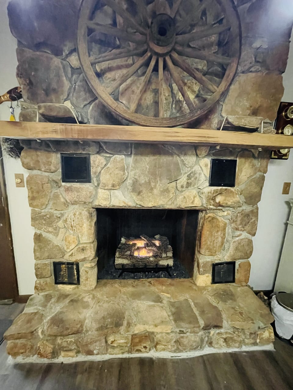Remote controlled gas logs in fireplace