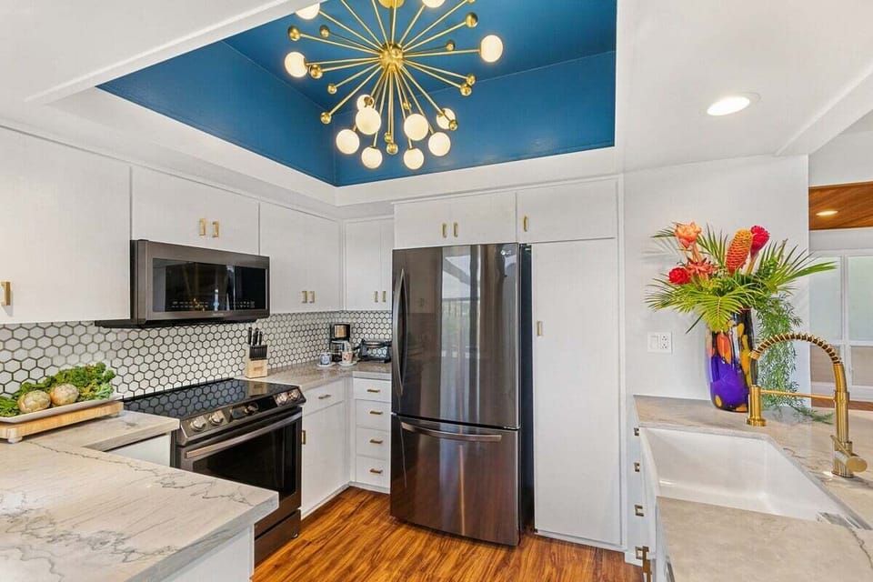Remodeled kitchen fully equipped with stainless appliances and modern finishes.