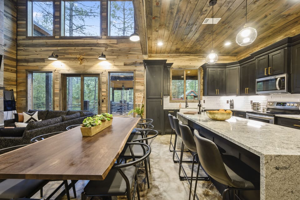 Large 10 seat dining table and island with ample seating for meals.