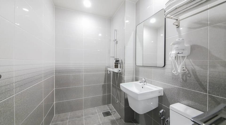 Double Twin Room | Bathroom | Shower, hair dryer, slippers, towels
