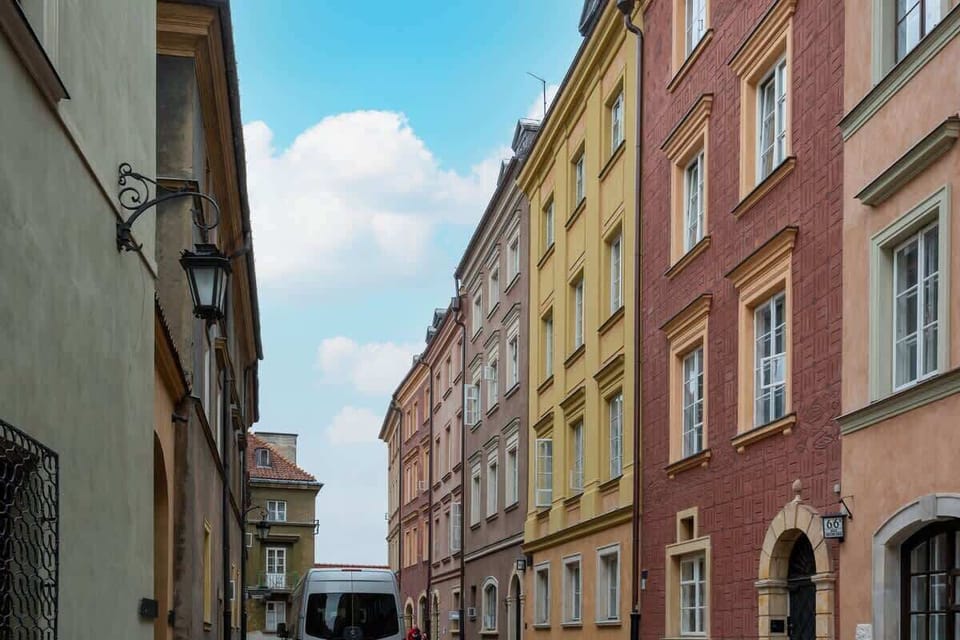 A beautiful street view featuring colorful facades of historic buildings in an old European town, showcasing timeless charm.