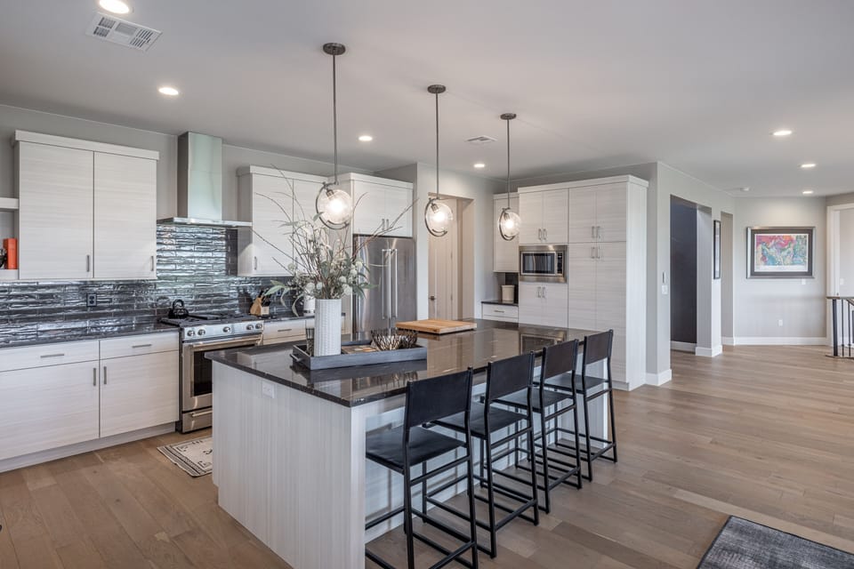 Kitchen - The kitchen is fully stocked with all the dishes, cookware, baking pans, and cutlery you will need for meal preparations and includes stainless steel appliances and granite counter tops.