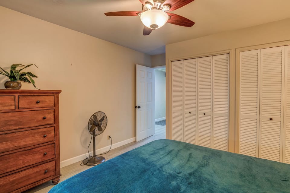Spacious bedroom with ample closet space and natural light.