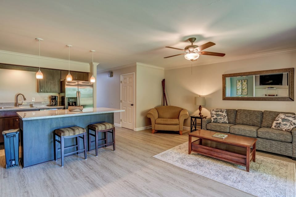 Updated kitchen with full-size appliances and sleek finishes makes cooking at home a breeze.