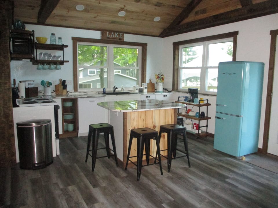 Second view of the kitchen with windows having a  lake view