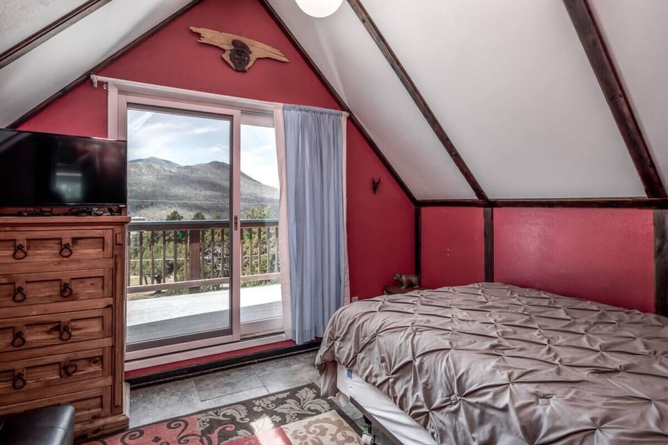 Upstairs queen bedroom with private balcony