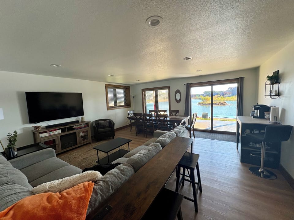Basement living area with streaming TV and large table for games