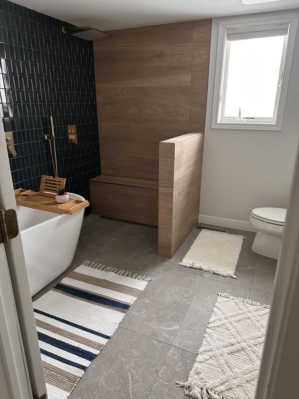 Luxury primary bathroom, soaker tub, rainfall shower, heated floors.