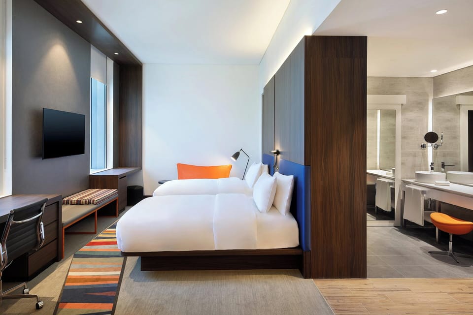 Hypo-allergenic bedding, down comforters, minibar, in-room safe