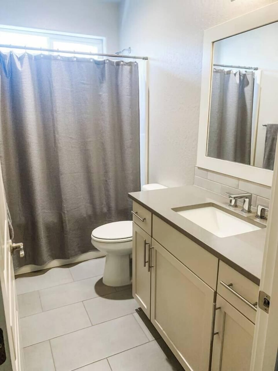 On the Main Level -Bathroom 2 is located in between Bedrooms 2 & 3 and has a nice deep tub and shower. Plenty of cabinet and draw space.