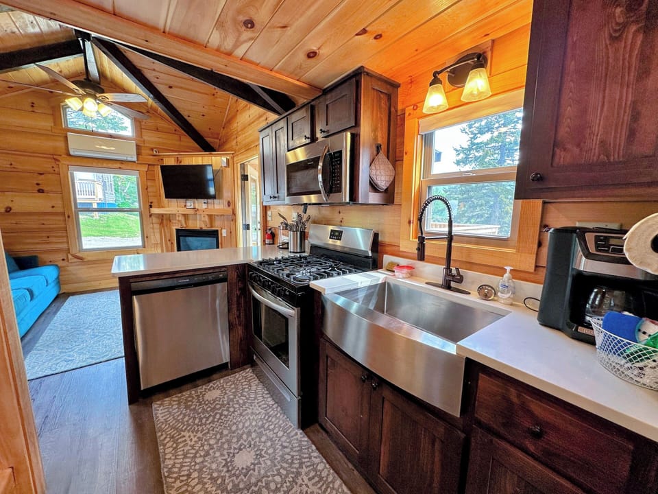 The kitchen has a dishwasher, microwave, oven and refrigerator as well as a stackable washer/dryer.