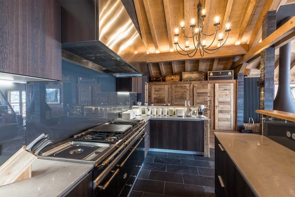 Warm wood accents give the kitchen a refined alpine feel