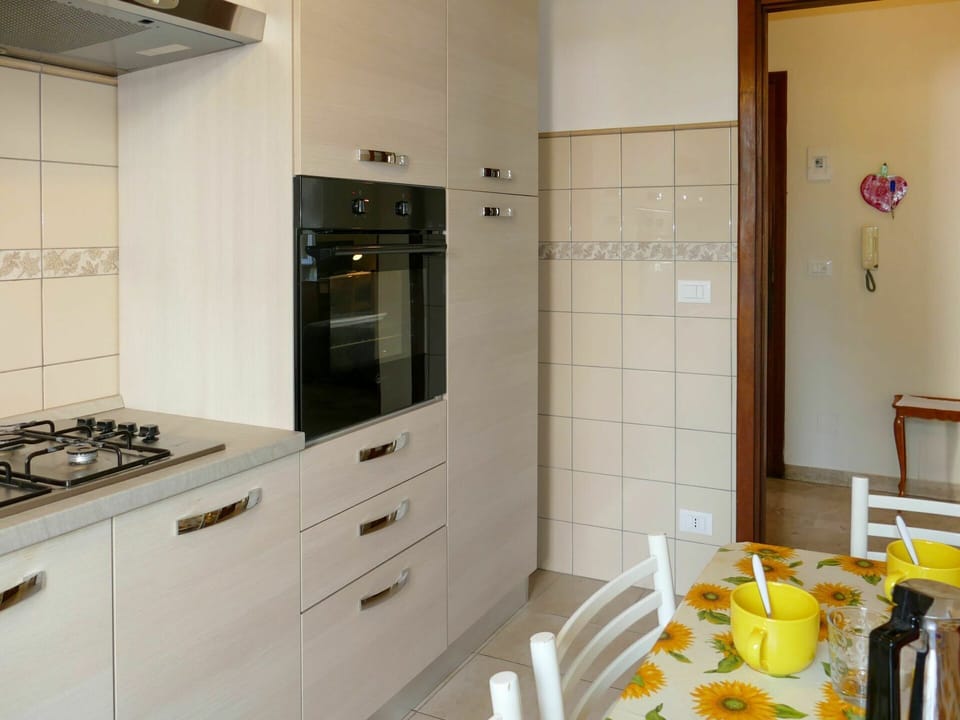 Cabinetry, Building, Furniture, Countertop, Kitchen, Wood, Interior Design, Drawer, Flooring, Yellow