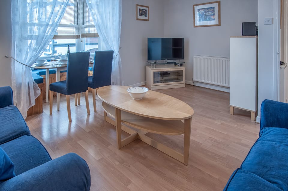 Apartment (2 Bedrooms) | Living area | 50-inch Smart TV with cable channels, TV
