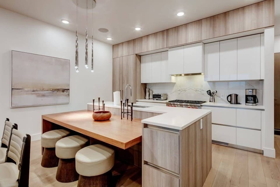 Fully stocked kitchen with Wolf, Sub-Zero appliances, breakfast bar seating for 3