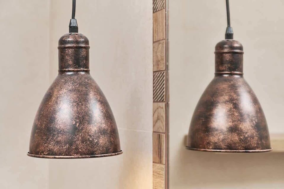 A detailed close-up of rustic pendant lights, adding character and warmth to the space.
