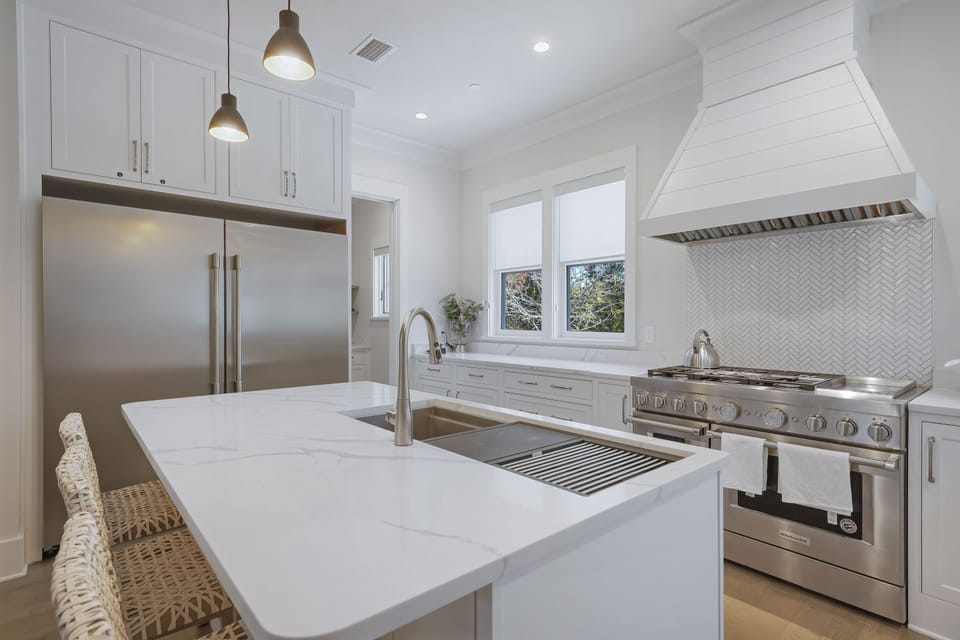 KITCHEN VIEW W/GALLEY SINK AND LARGE 66" FRIDGE