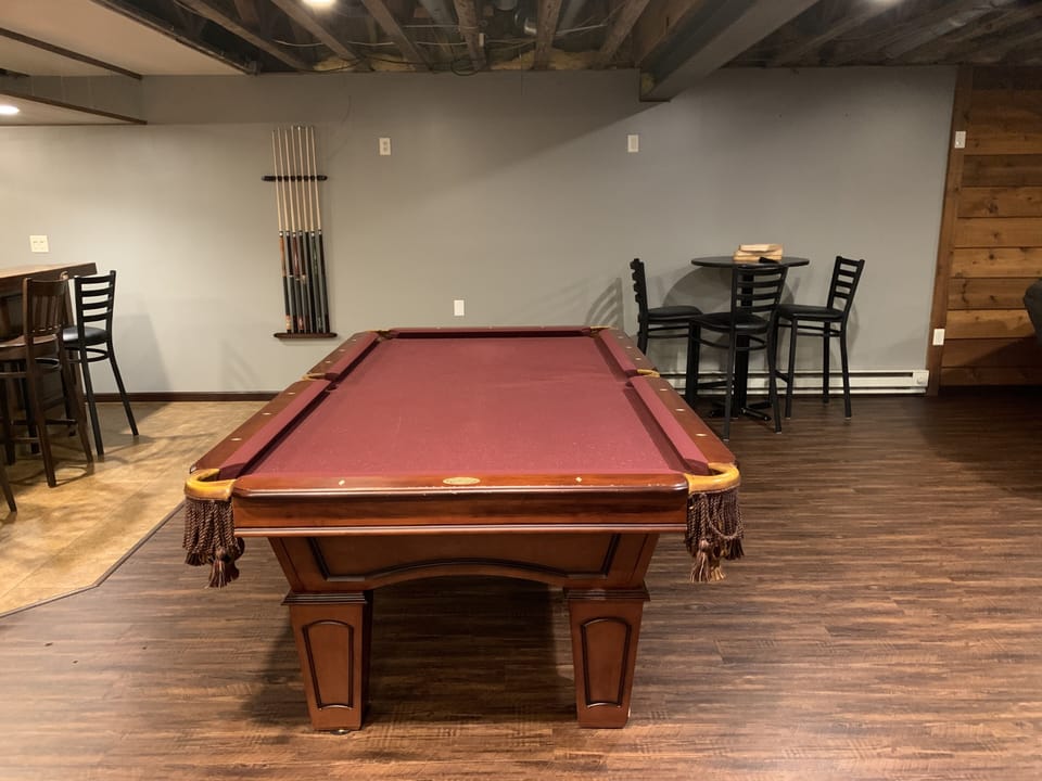 Pool table by basement bar