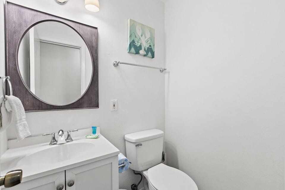 Powder room right off kitchen.