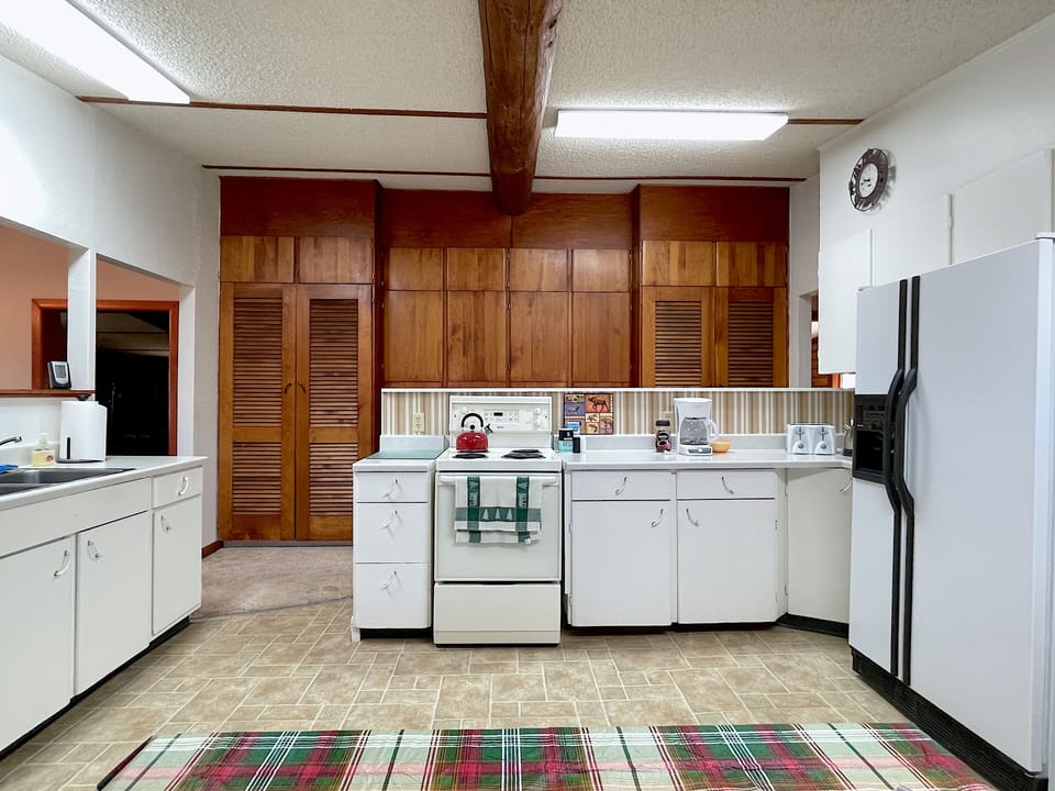 Kitchen looking into hallway with custom built-ins