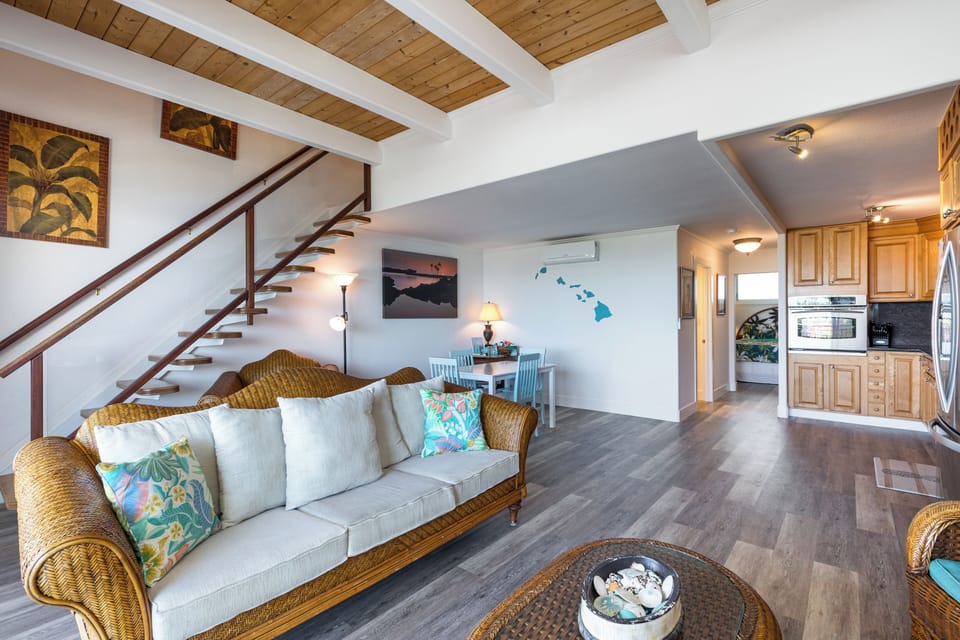 Living room & stairs leading to the upstairs bedroom.
