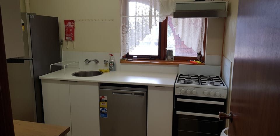 Kitchenette complete with cook top, oven and fridge