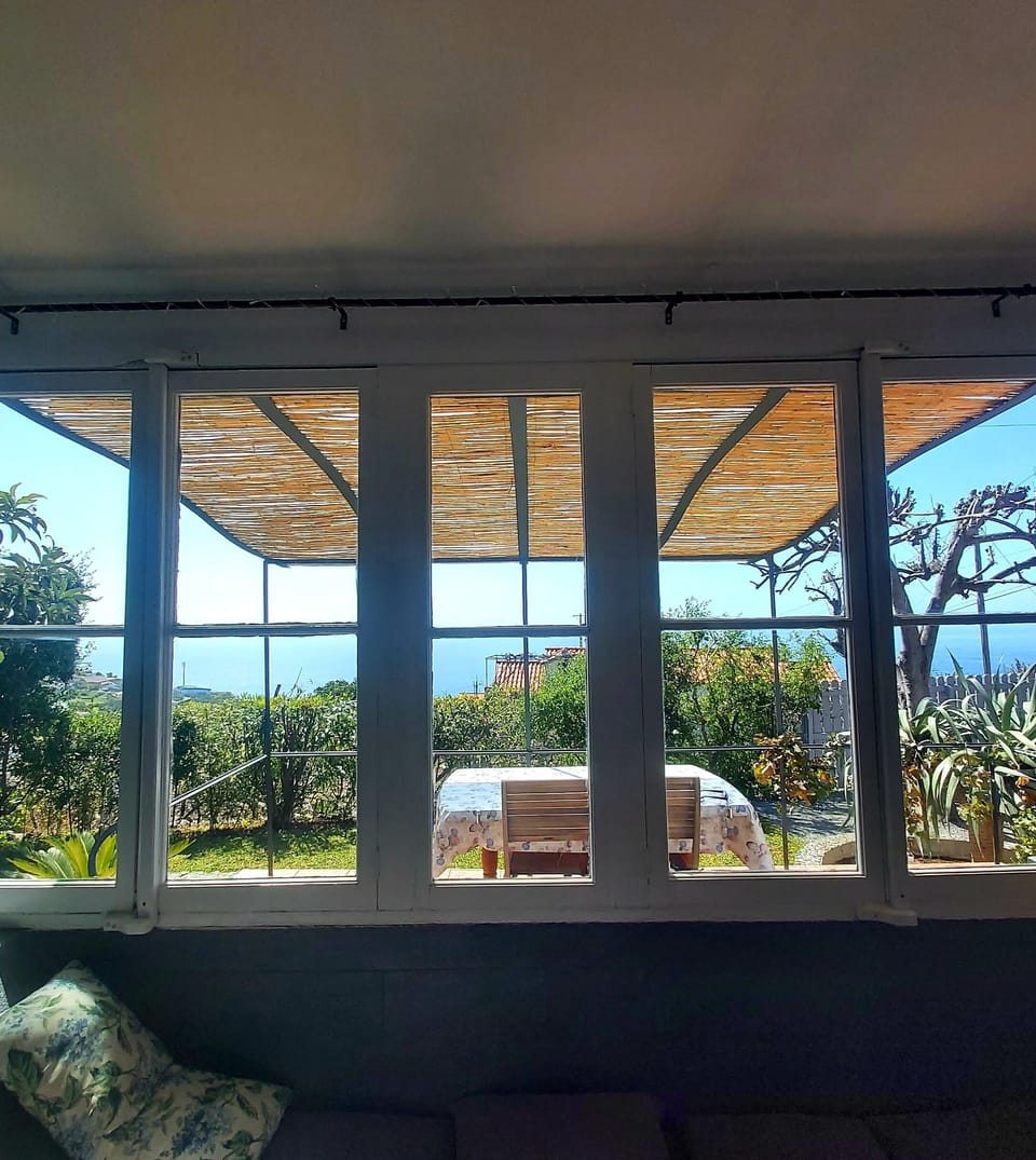 Large windows look over the gardens with sea views