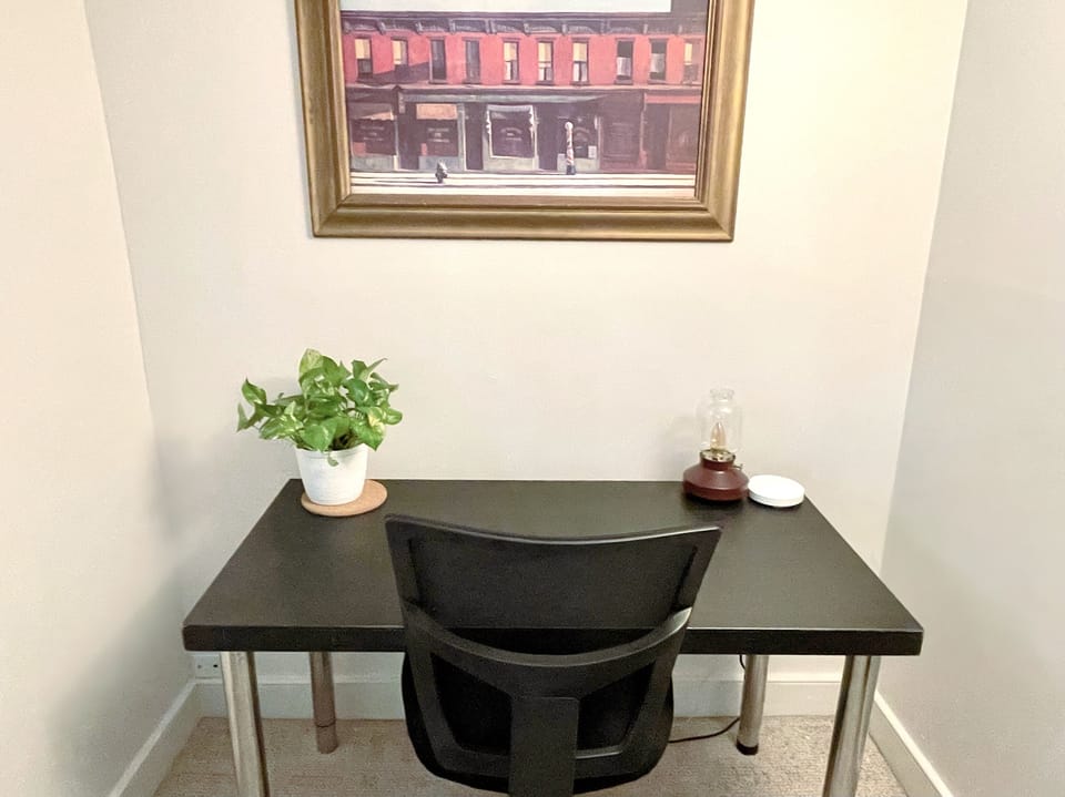 Small office off of living room for an easy work/travel set up.