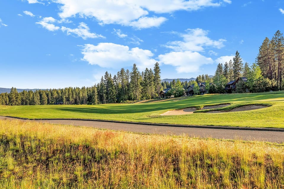 An oasis of relaxation awaits in this high-end mountain home overlooks hole 12 on Rope Rider