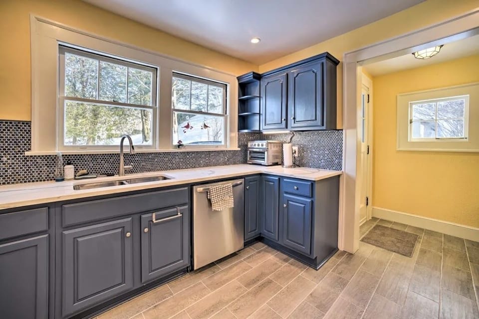 Full kitchen with all appliances, cookware, cooking basics, and dishware.