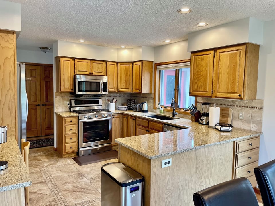 Silverware, pots, pans, and cooking essentials can all be found in the kitchen.
