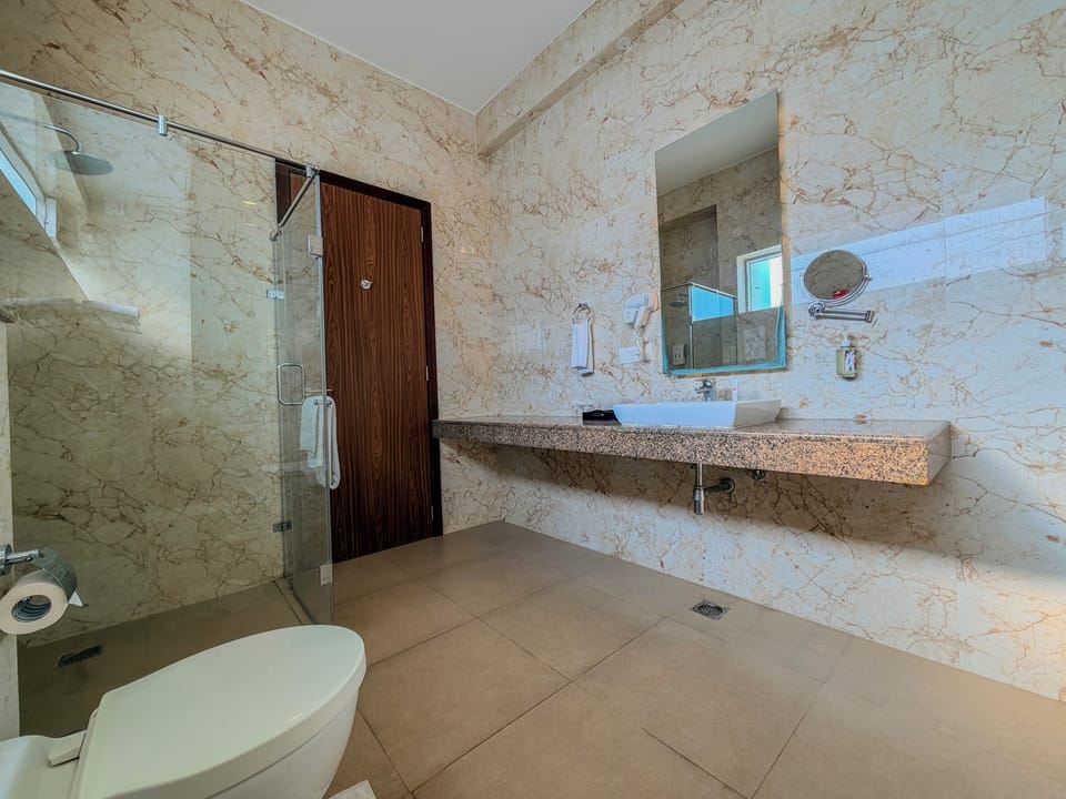Suite | Bathroom | Shower, designer toiletries, hair dryer, slippers